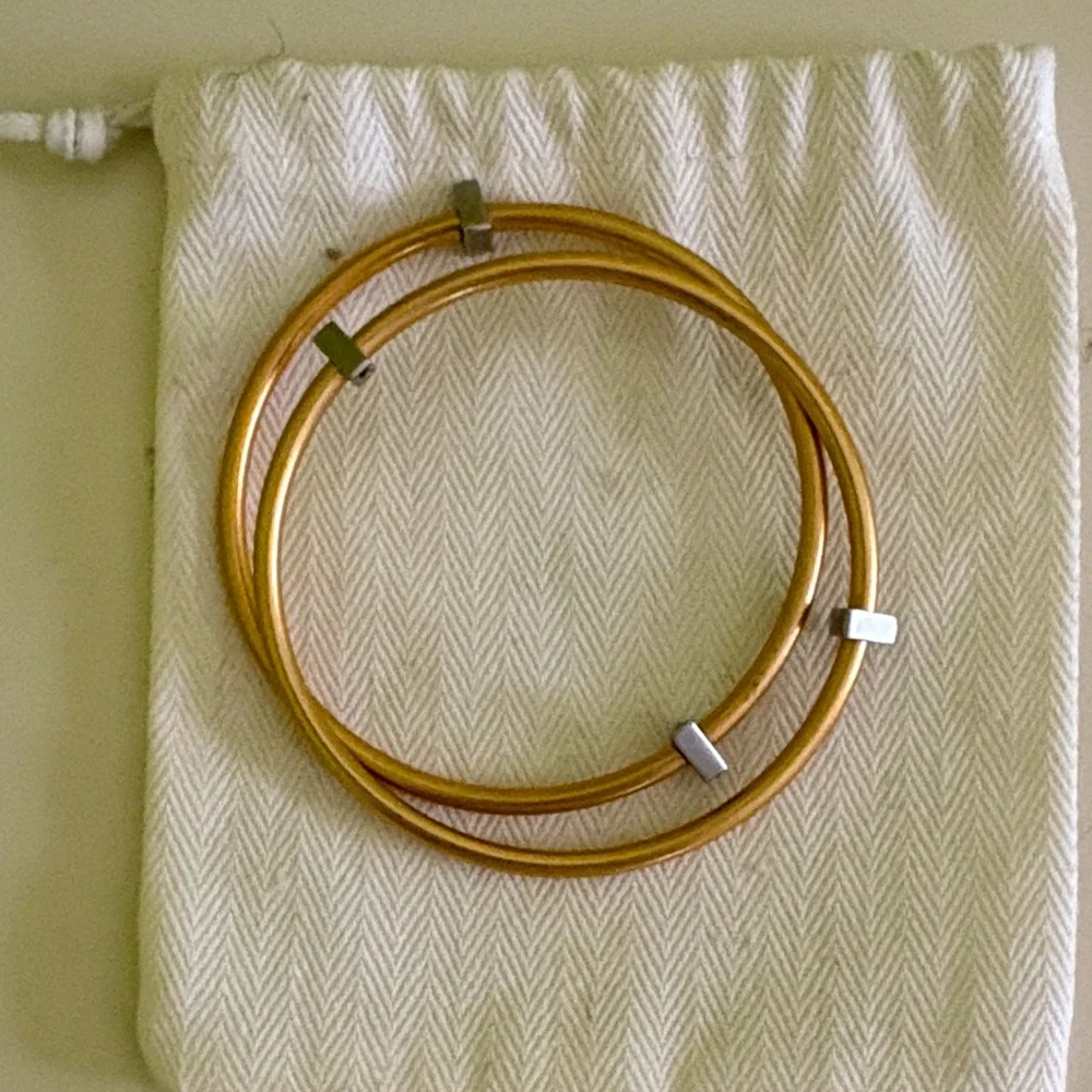 Pair of Gold tone Bangle Bracelets great stacked w/ additional bracelets
